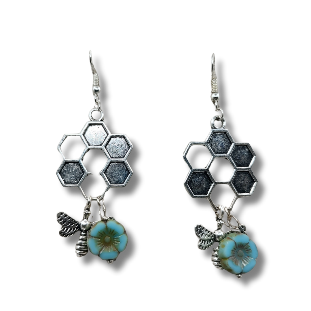 9 <ul> <li>Stylish and Unique Design: These adorable honeycomb earrings with dangling bees are the perfect statement piece for any outfit. The intricate design adds a touch of charm and whimsy to your look.</li> <li>Lightweight and Comfortable: Crafted from allergy-free plated silver, these dainty earrings are comfortable to wear all day long. You'll forget you even have them on while enjoying their eye-catching beauty.</li> <li>Versatile Everyday Wear: With a total length of about 2 inches, these earrings are suitable for everyday wear throughout the year. They effortlessly transition from casual to formal occasions, making them a versatile accessory in your jewelry collection.</li> <li>Perfect Gift Idea: Whether it's for a friend or yourself, these handmade honeycomb earrings make a special and thoughtful gift. The unique design and quality craftsmanship will surely delight the recipient on any occasion.</li> <li>Handmade Quality: Each pair of these charming earrings is handmade with attention to detail, ensuring a high level of craftsmanship and uniqueness in every piece. Add a touch of artisanal flair to your jewelry collection with these delightful bee-themed earrings.</li> </ul>